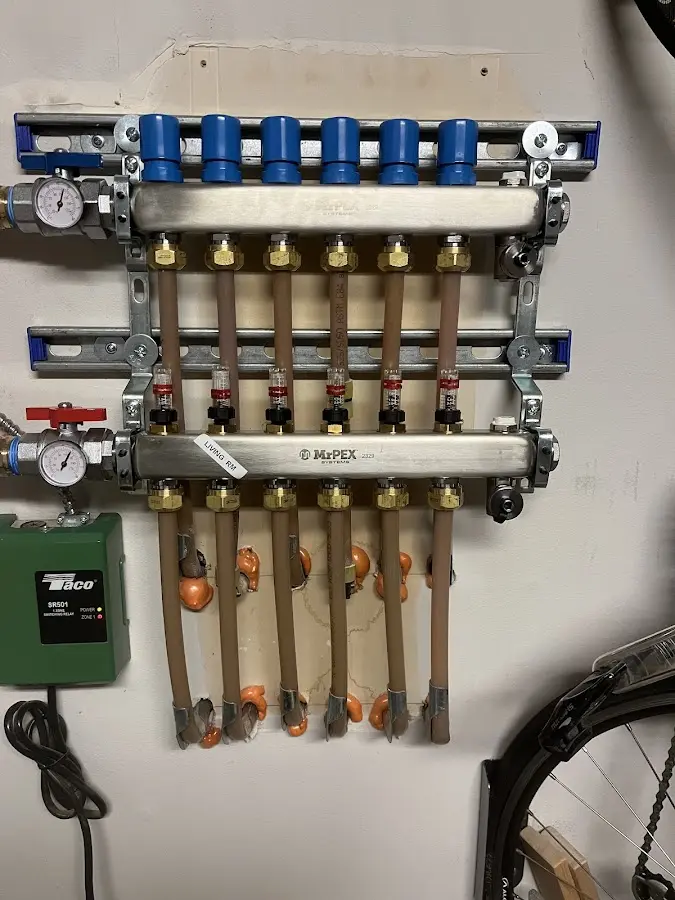 Plumber performing Water Heater Repair at a residential property in Northfield